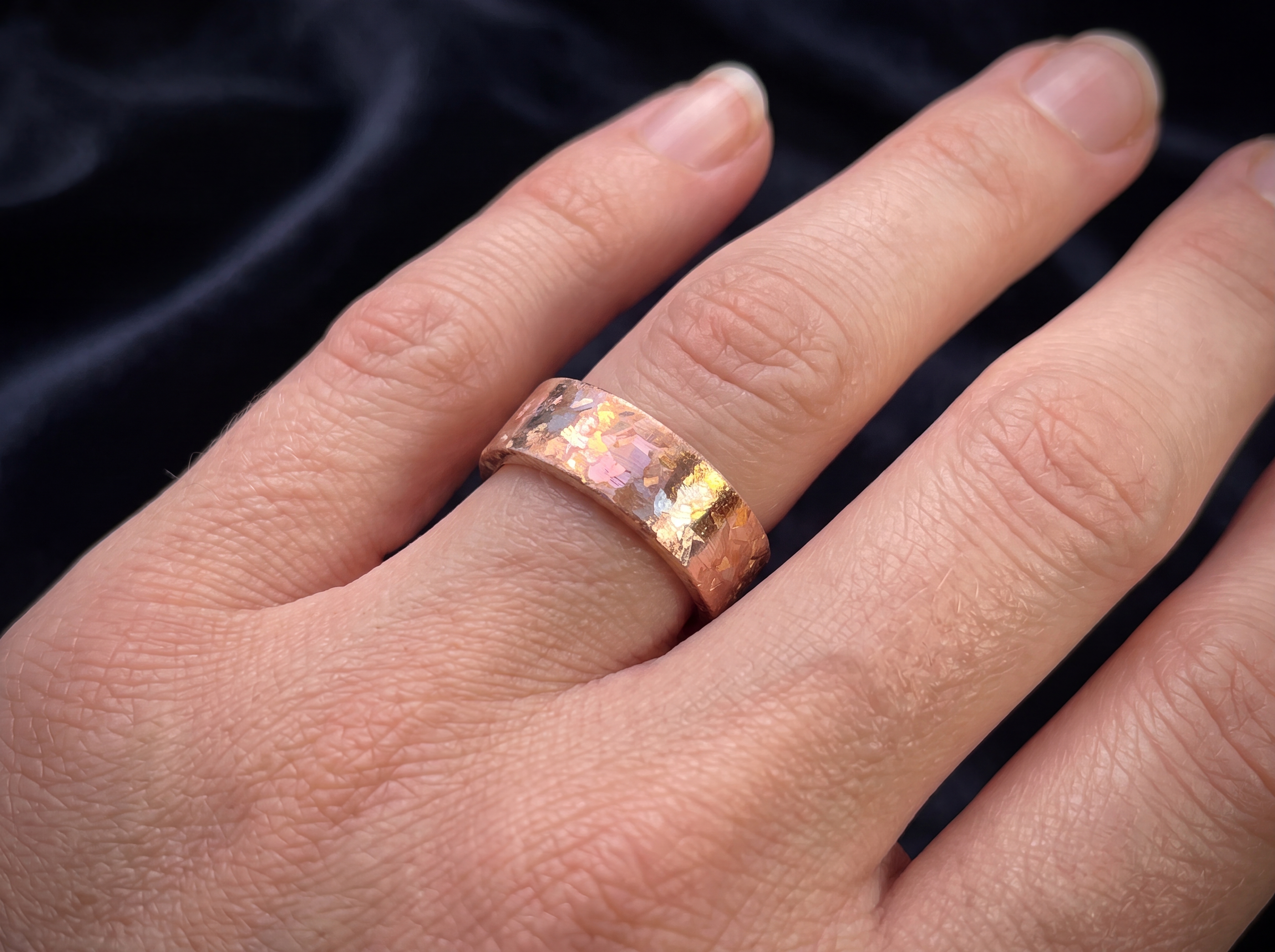 Cuprite ring worn on hand